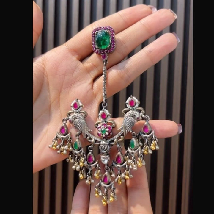 Traditional temple-style chandelier earring.
